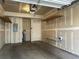 Spacious garage with ample storage, shelving, a work bench, and great potential for organization at 5420 Allison St # 202, Arvada, CO 80002