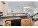 Bright kitchen featuring light wood cabinets, modern appliances, and an open layout at 5420 Allison St # 202, Arvada, CO 80002