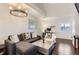 This modern living room has hardwood floors, high ceilings, and comfortable seating at 5420 Allison St # 202, Arvada, CO 80002