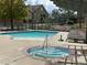 Sparkling pool and hot tub with surrounding lounge area, offering a perfect oasis for residents at 5420 Allison St # 202, Arvada, CO 80002