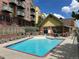 Resort-style pool area with comfortable lounge chairs, perfect for relaxation and recreation at 5420 Allison St # 202, Arvada, CO 80002
