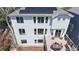 Aerial view of backyard featuring an outdoor deck, patio, and a solar paneled roof at 9804 N Crystal Lake Dr, Littleton, CO 80125