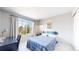 Bright bedroom with a large window, study desk and a bed with skateboard headboard at 9804 N Crystal Lake Dr, Littleton, CO 80125