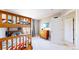Bedroom featuring wooden bunkbeds, a dresser, and a window with natural light at 9804 N Crystal Lake Dr, Littleton, CO 80125