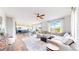 Bright and open-concept living room flowing into the kitchen and dining area, perfect for modern living at 9804 N Crystal Lake Dr, Littleton, CO 80125