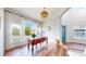 Bright home office featuring hardwood floors, a lovely desk, arched window, and modern decor at 9804 N Crystal Lake Dr, Littleton, CO 80125