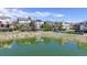 Beautiful water view surrounded by lush landscaping and well-maintained homes at 9804 N Crystal Lake Dr, Littleton, CO 80125