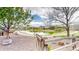 Picturesque pond view showcasing a wooden gate, walking path, and peaceful surroundings at 9804 N Crystal Lake Dr, Littleton, CO 80125
