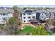 Aerial view of the house featuring a backyard, deck, solar panels, and outdoor seating at 9804 N Crystal Lake Dr, Littleton, CO 80125