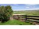 Home has a fenced backyard overlooking open fields and has beautiful landscaping at 2296 E 109Th Dr, Northglenn, CO 80233