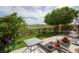 Home has a large backyard with an open view, a wooden fence, and mature trees at 2296 E 109Th Dr, Northglenn, CO 80233