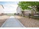 Attractive single-Gathering home with a gravel yard, wooden fence, and an attached single-car garage at 2296 E 109Th Dr, Northglenn, CO 80233