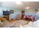 Comfortable living room with hardwood floors, neutral paint, lots of natural light, dining area and staircase at 2296 E 109Th Dr, Northglenn, CO 80233