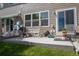 Home's rear patio has ample room for grilling and has stairs down to the lawn at 2296 E 109Th Dr, Northglenn, CO 80233