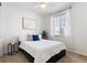 Cozy bedroom with a queen bed, window with blinds, and a side table at 5107 Ditmars Ln, Castle Rock, CO 80104