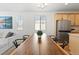 Elegant dining area features a long wood table and modern chairs at 5107 Ditmars Ln, Castle Rock, CO 80104