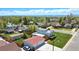 This home boasts a spacious yard, detached garage, and a stunning view of the mountains at 1400 S Knox Ct, Denver, CO 80219
