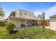 Expansive backyard featuring a covered patio, perfect for outdoor entertaining at 1400 S Knox Ct, Denver, CO 80219