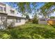 Well-maintained backyard with healthy lawn and convenient shed. Great outdoor space for relaxation or recreation at 1400 S Knox Ct, Denver, CO 80219