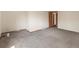 Empty bedroom with neutral carpet and wood trim at 1400 S Knox Ct, Denver, CO 80219