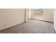 Bright bedroom featuring neutral walls, carpet flooring, and a window at 1400 S Knox Ct, Denver, CO 80219