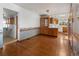 Open dining room with hardwood floors and lots of natural light at 1400 S Knox Ct, Denver, CO 80219
