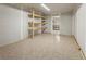Inside view of a shed with tile flooring and shelving at 1400 S Knox Ct, Denver, CO 80219