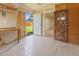 View of the inside of a backyard shed with work table and tile flooring at 1400 S Knox Ct, Denver, CO 80219