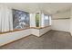 Sitting room features carpet and big window at 1400 S Knox Ct, Denver, CO 80219