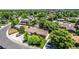 Aerial view showing the property with fenced yard, mature trees, shed, and a residential neighborhood at 9170 Aspen Dr, Thornton, CO 80229