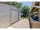 Backyard featuring a shed, grassy area, and partially covered outdoor kitchen at 9170 Aspen Dr, Thornton, CO 80229