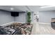 Basement featuring a large area rug, TV, and open layout to other areas at 9170 Aspen Dr, Thornton, CO 80229