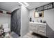 Bathroom featuring a modern vanity, shower, and toilet in a well-lit space at 9170 Aspen Dr, Thornton, CO 80229