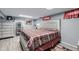 Bedroom with matching dressers and a queen-sized bed beneath two skylights at 9170 Aspen Dr, Thornton, CO 80229