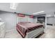 Well-lit bedroom features a queen-sized bed, two skylights and a flat screen TV at 9170 Aspen Dr, Thornton, CO 80229
