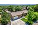 Charming ranch-style home features a well-maintained lawn, mature trees, and an attached two-car garage at 9170 Aspen Dr, Thornton, CO 80229