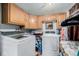 Functional laundry room with ample cabinet space, modern washer and dryer units, and storage solutions at 9170 Aspen Dr, Thornton, CO 80229