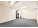 Unfinished basement with neutral carpet and light colored walls provides a blank canvas for your ideas at 5556 Vaughn St, Denver, CO 80239