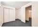 Basement bedroom featuring neutral carpet and closet space at 5556 Vaughn St, Denver, CO 80239