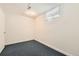 The home has a bedroom with wall-to-wall carpet, light-colored walls and a window with a view at 5556 Vaughn St, Denver, CO 80239