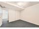 A large bedroom with wall-to-wall carpet, light-colored walls and a spacious closet at 5556 Vaughn St, Denver, CO 80239