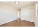 A bright bedroom with beautiful hardwood floors and ample closet space, perfect for relaxation and storage at 5556 Vaughn St, Denver, CO 80239