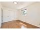 Bright bedroom featuring hardwood floors, a window that allows plenty of natural light and a closet at 5556 Vaughn St, Denver, CO 80239