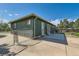 Exterior home featuring a fenced yard and large driveway at 5556 Vaughn St, Denver, CO 80239