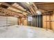 Unfinished garage interior with a window and ample natural light at 5556 Vaughn St, Denver, CO 80239