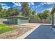 Detached garage with an extra long driveway, and additional grass area at 5556 Vaughn St, Denver, CO 80239