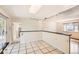 Spacious dining area adjacent to kitchen with tile floors and sliding door to patio at 5556 Vaughn St, Denver, CO 80239