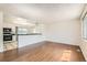 Bright and airy living space featuring beautiful hardwood floors and an open layout at 5556 Vaughn St, Denver, CO 80239