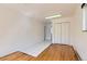 A spacious living room featuring mixed flooring and a large closet, ready for your personal touch at 5556 Vaughn St, Denver, CO 80239