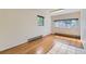 Living room showcasing windows for natural light and beautiful hardwood floors at 5556 Vaughn St, Denver, CO 80239